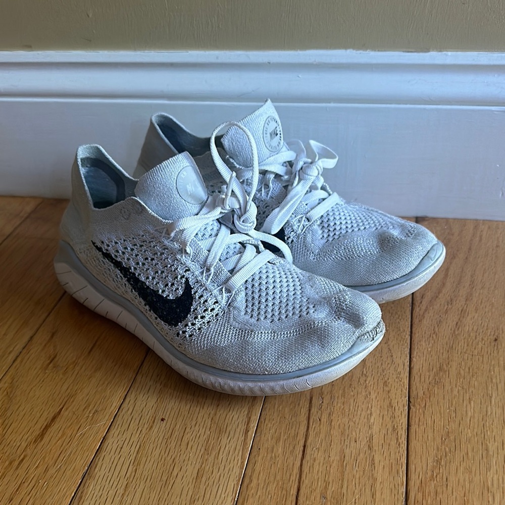 Nike Flyknit White Sneakers with Black Swoosh